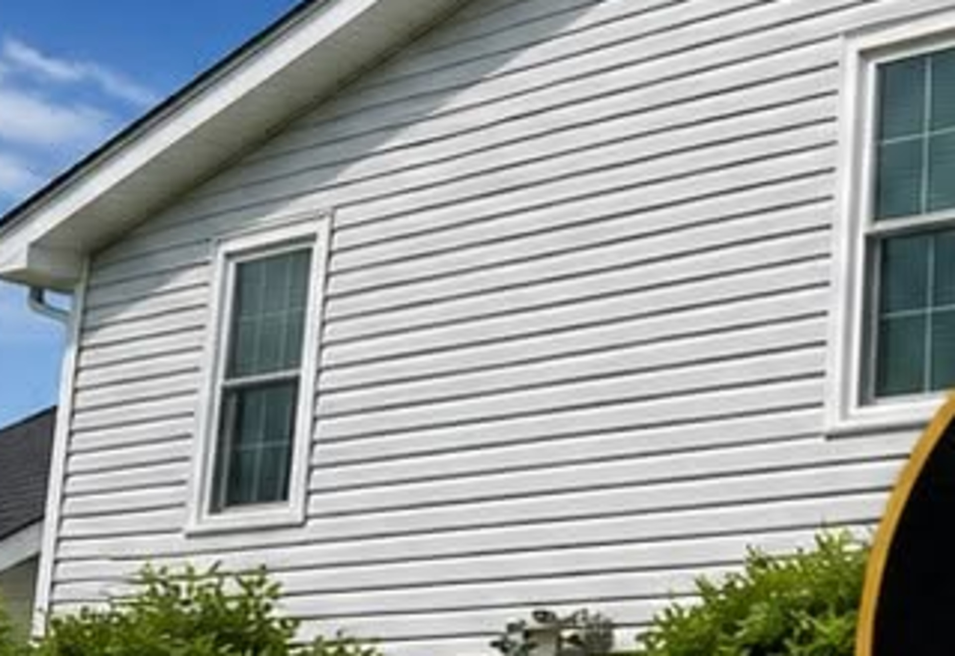 House washing on South Coast vinyl siding — after cleaning